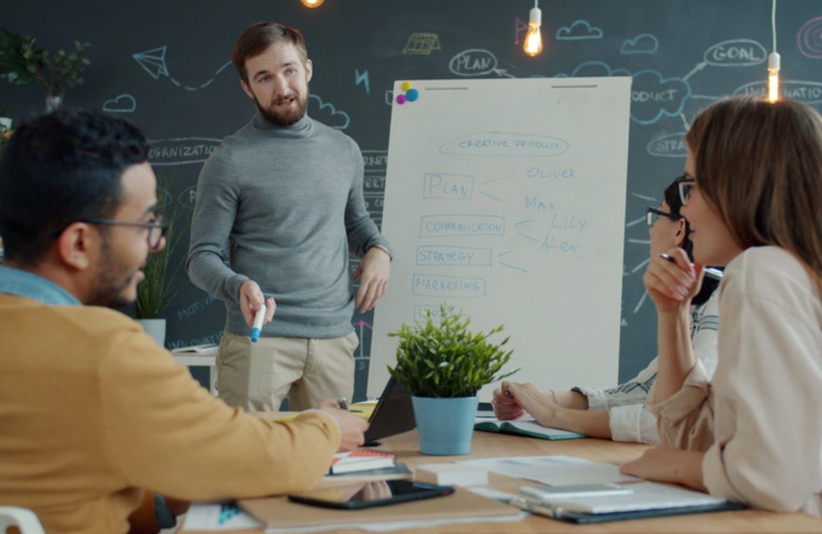 Small business team brainstorming brand positioning during a strategy meeting