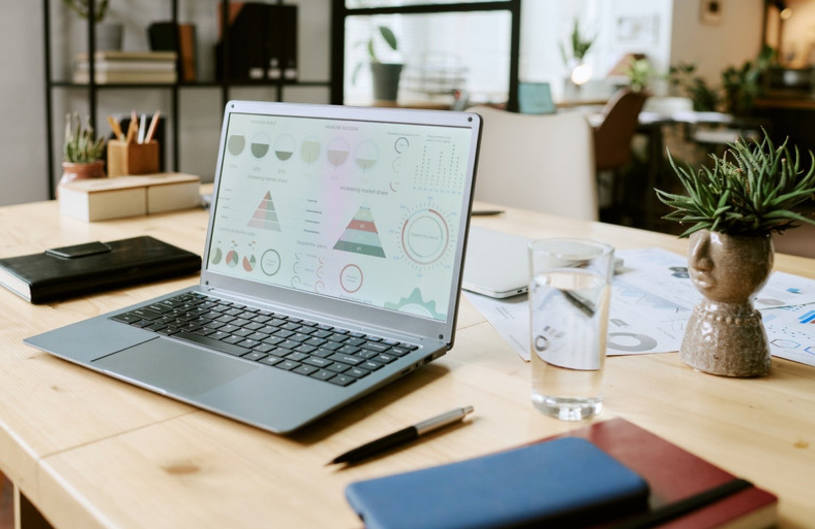 Laptop showing a marketing analytics dashboard on a desk